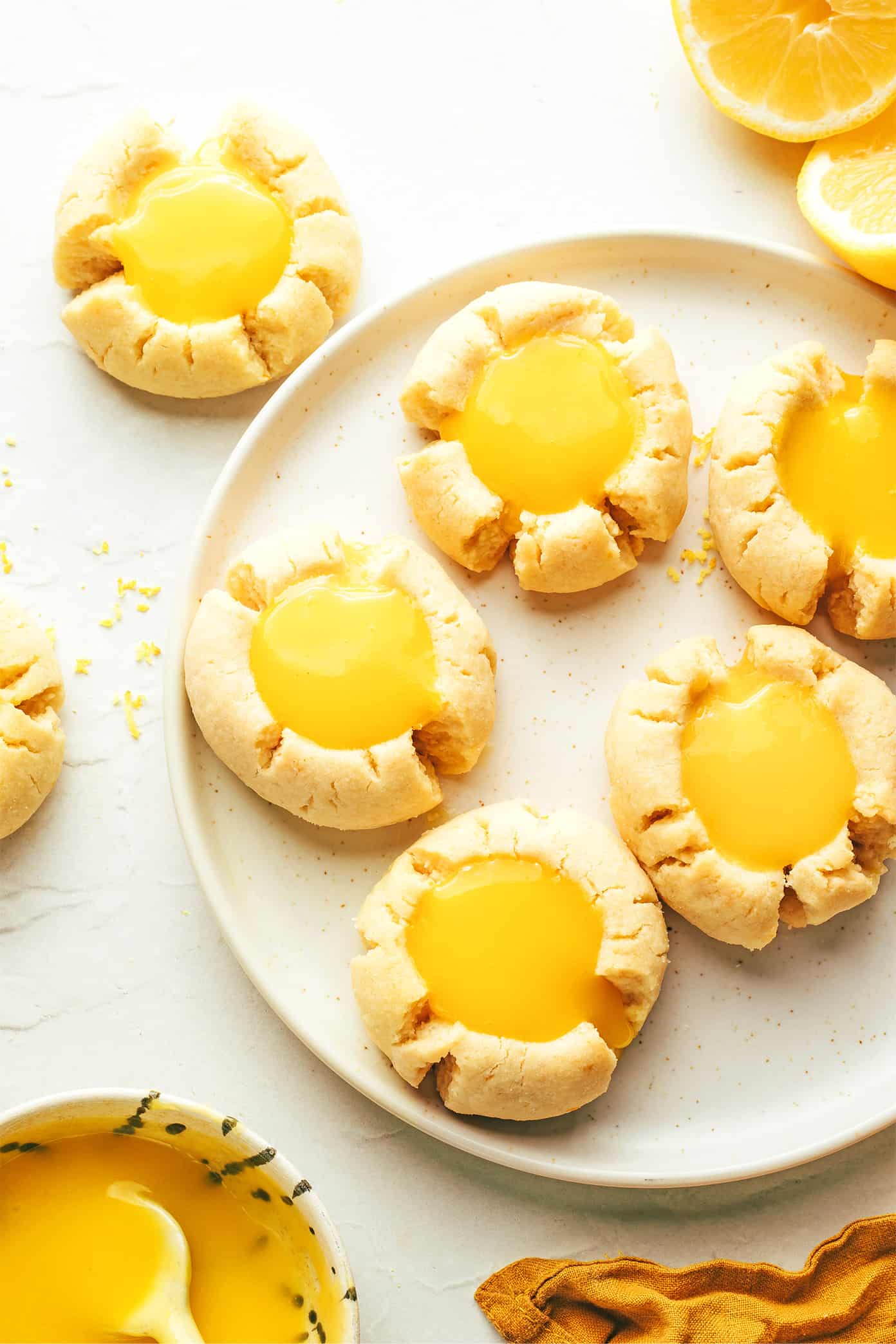 Lemon Thumbprint Cookies on plate with lemon curd