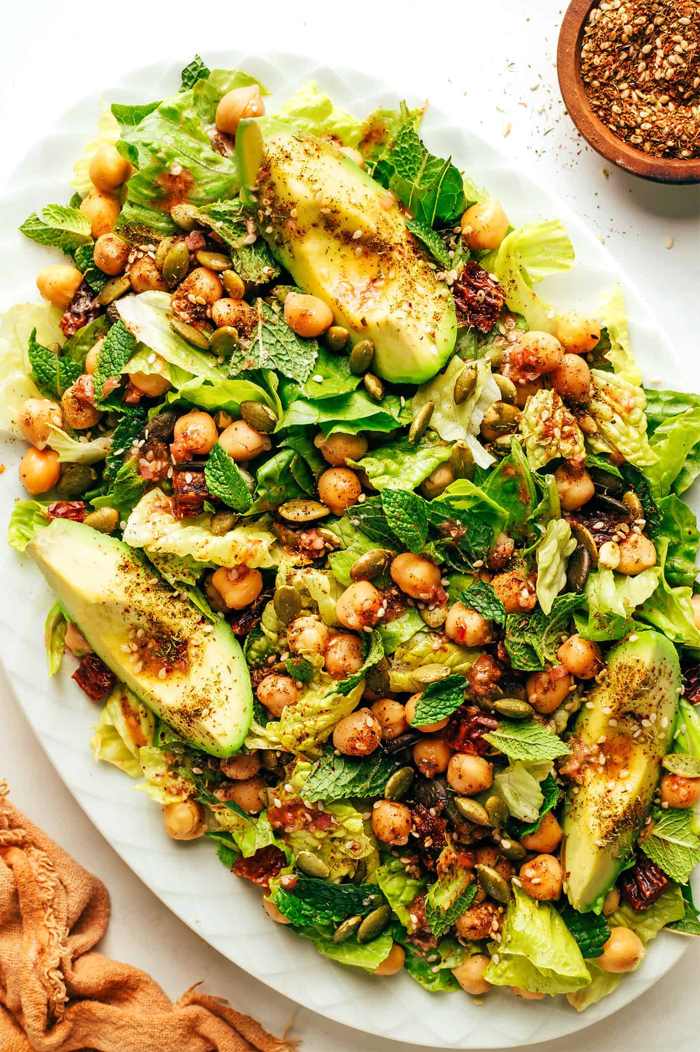 Chickpea, Date and Avocado Salad with Za'atar Vinaigrette on serving platter